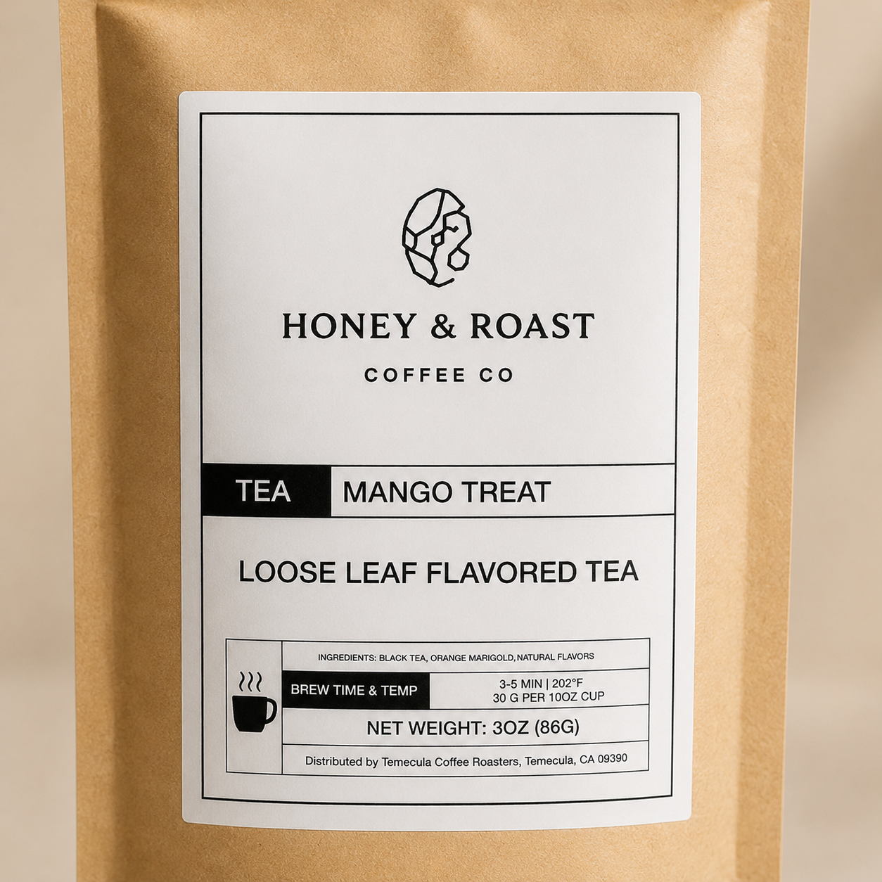 A 3 oz stand-up pouch of Honey & Roast Coffee Co. Mango Treat Loose Leaf Flavored Tea, in a kraft brown paper bag with a white label.