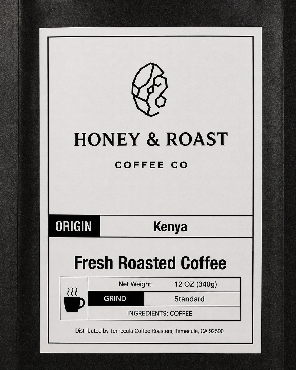 A close-up of a coffee package label for Honey & Roast Coffee Co., showing the Kenya origin, fresh roasted coffee, and standard grind details.