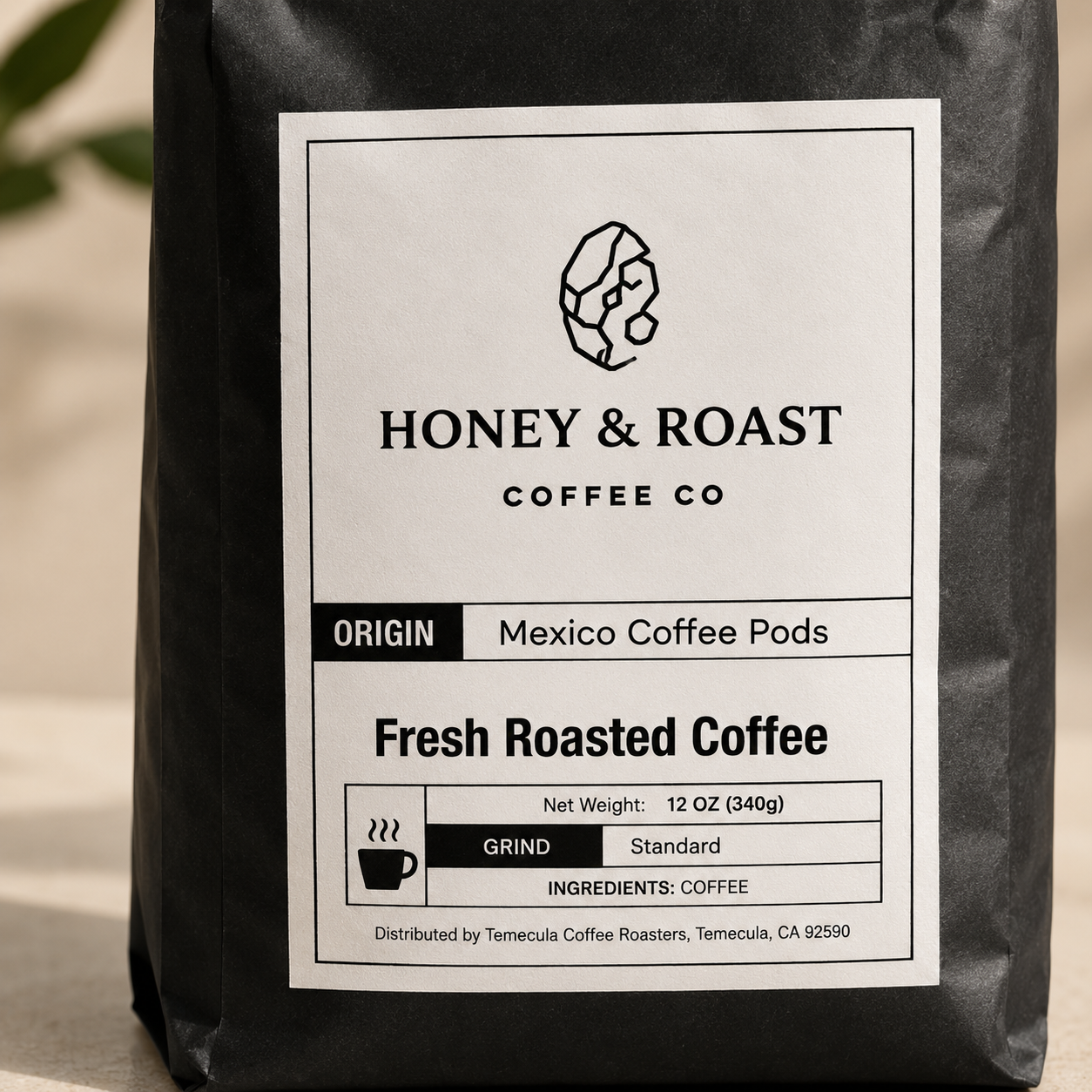 A black bag of Honey & Roast Coffee Co. Fresh Roasted Coffee, Mexico Coffee Pods, with a white label showing product details like origin, weight, and grind.